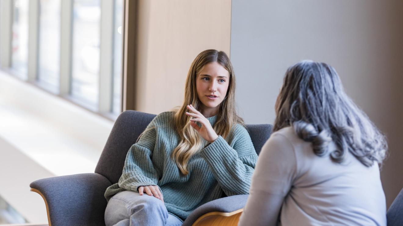 Two women sitting and talking
